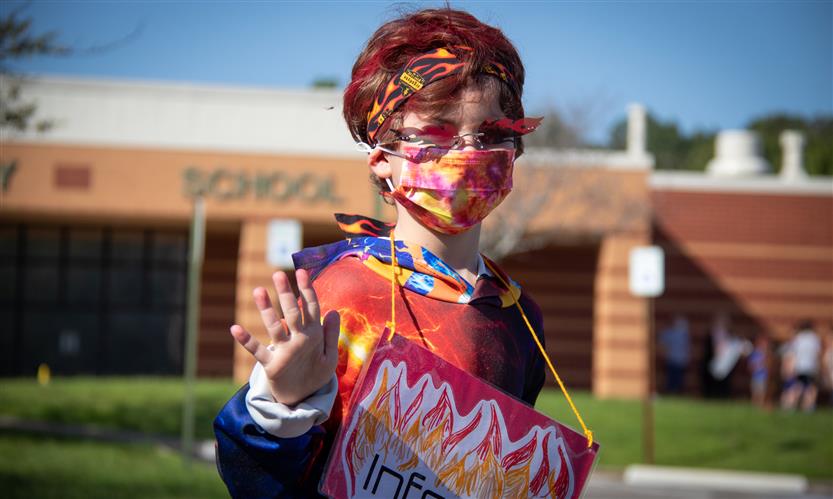 A boy dressed as an inferno